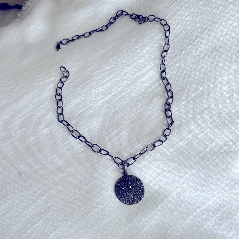 Black Diamond necklace on black/silver 20” chain.